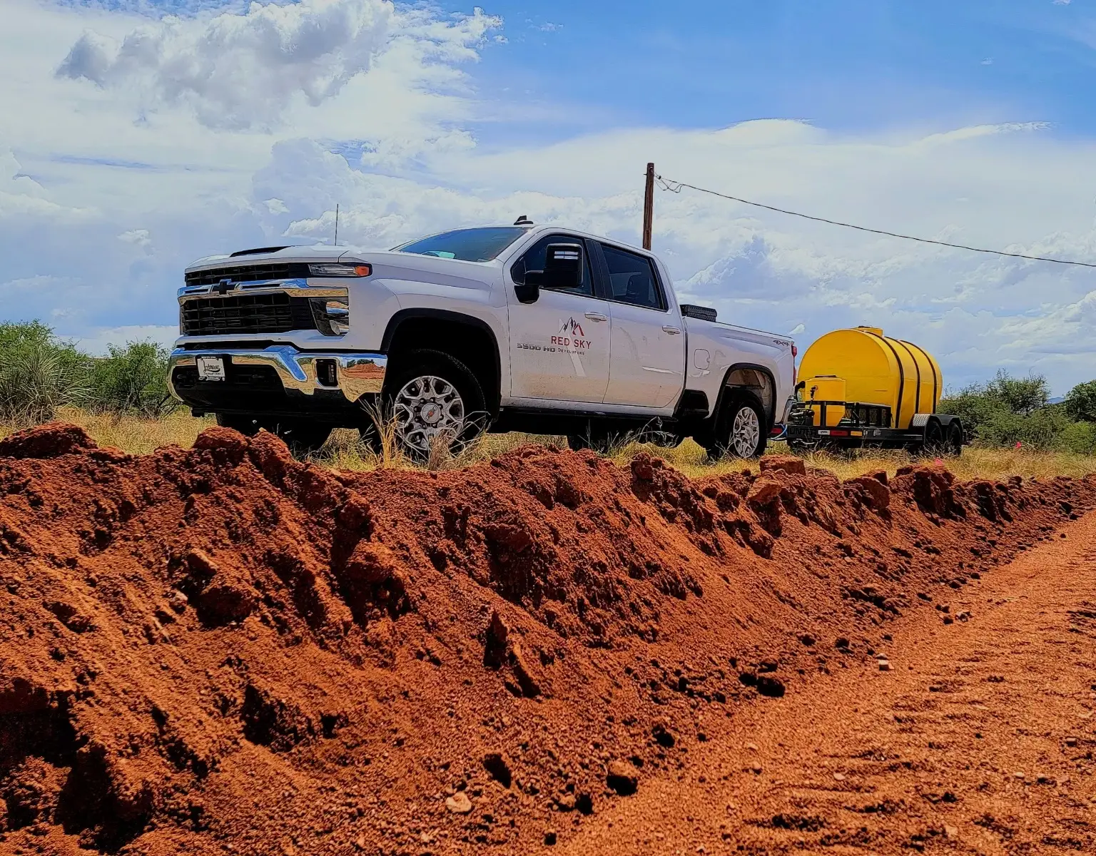 Company vehicle hauling a fluid tank